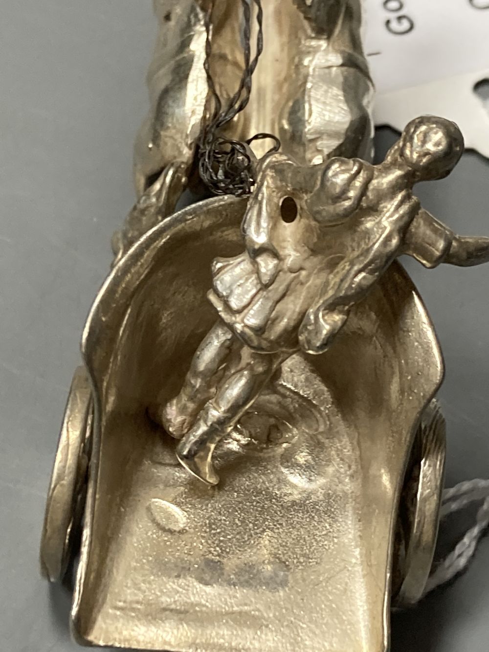 A matched set of three modern silver models of chariots with rider and horses, maker SMD, London, 1965/6, length 9cm, 8.5oz.